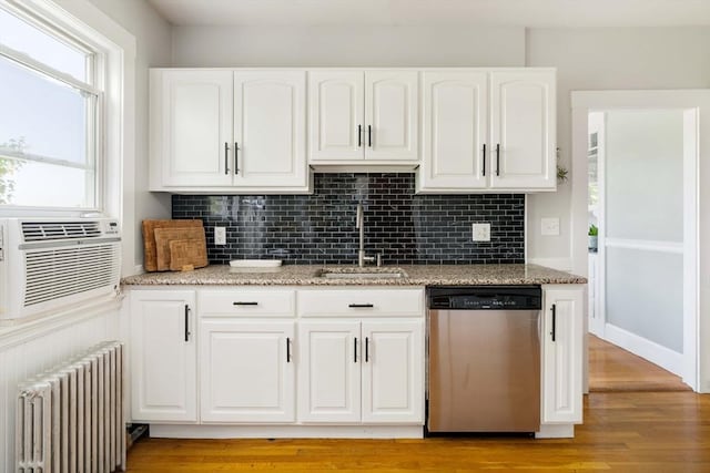 67 Jamaica Unit 3, Boston, MA 02130 - kitchen with stainless steel dishwasher, radiator, a sink, and light stone counters