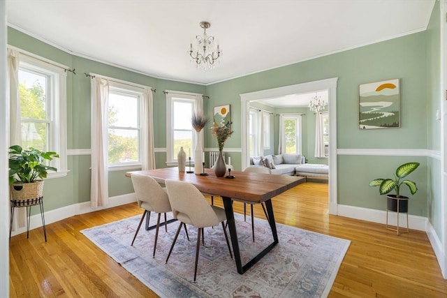 67 Jamaica Unit 3, Boston, MA 02130 - dining space featuring a chandelier, ornamental molding, baseboards, and light wood finished floors