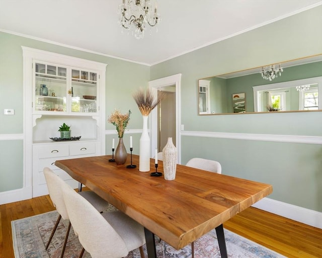 67 Jamaica Unit 3, Boston, MA 02130 - dining room with a chandelier, wood finished floors, baseboards, and crown molding