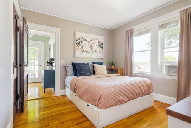 67 Jamaica Unit 3, Boston, MA 02130 - bedroom with crown molding, light wood-style floors, and baseboards