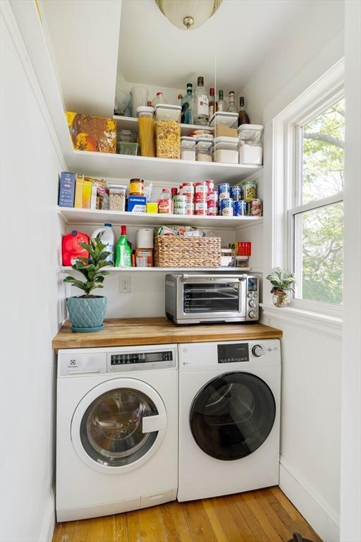 67 Jamaica Unit 3, Boston, MA 02130 - laundry area featuring independent washer and dryer, light wood-type flooring, and baseboards