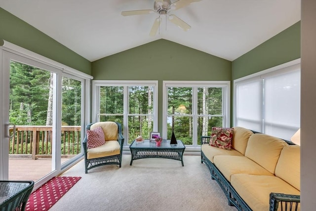 sunroom / solarium with ceiling fan and lofted ceiling