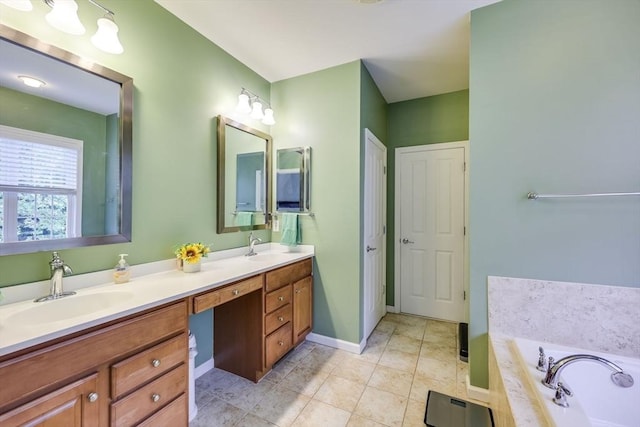 bathroom with tile patterned floors, vanity, and a bath