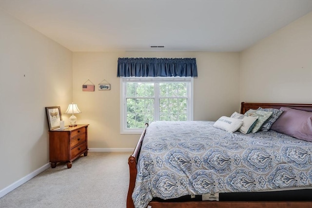 bedroom with light carpet