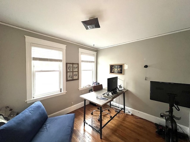 office area with crown molding, wood finished floors, and baseboards