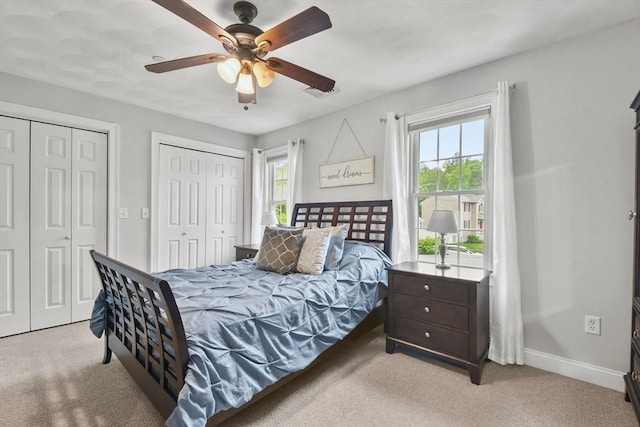 5239 N Main St Unit 7, Fall River, MA 02720 - bedroom with two closets, light carpet, and multiple windows