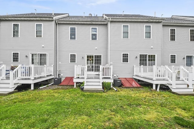 5239 N Main St Unit 7, Fall River, MA 02720 - back of property featuring a deck, a yard, and central air condition unit