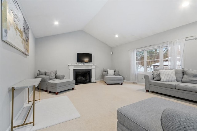 carpeted living room with recessed lighting, baseboards, lofted ceiling, and a fireplace with flush hearth