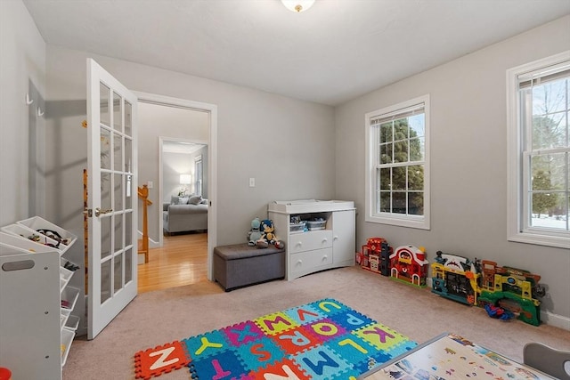 recreation room with french doors and carpet floors