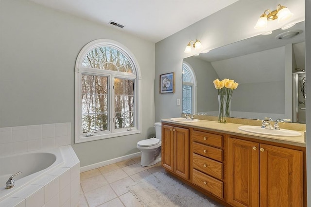 bathroom with tile patterned flooring, visible vents, toilet, and a sink