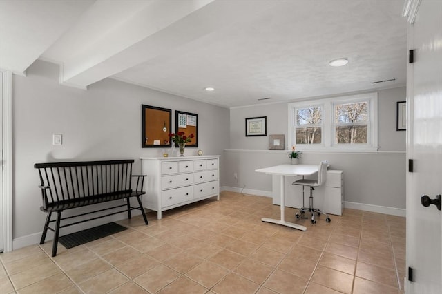 home office with light tile patterned floors and baseboards