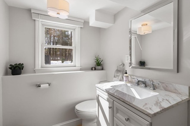 bathroom with toilet and vanity