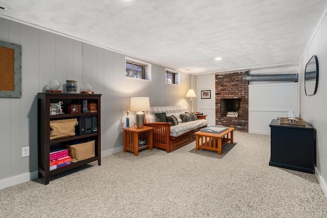 carpeted living area with a brick fireplace and baseboards