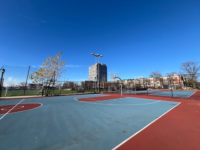 view of basketball court with tennis court