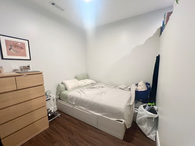 bedroom featuring dark hardwood / wood-style flooring