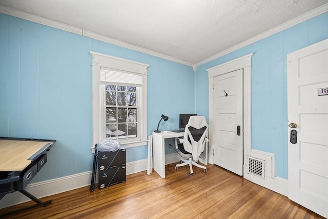 home office featuring crown molding and wood-type flooring