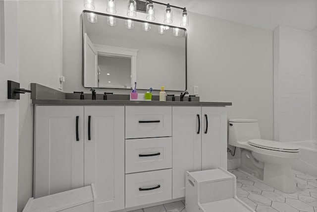 bathroom with vanity and toilet