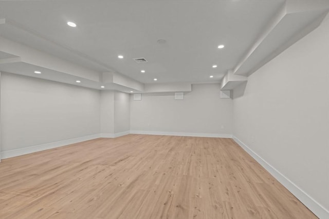 basement featuring light hardwood / wood-style floors