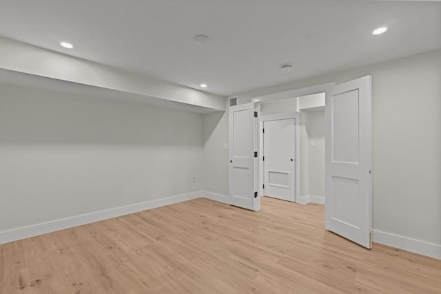 basement featuring light hardwood / wood-style flooring