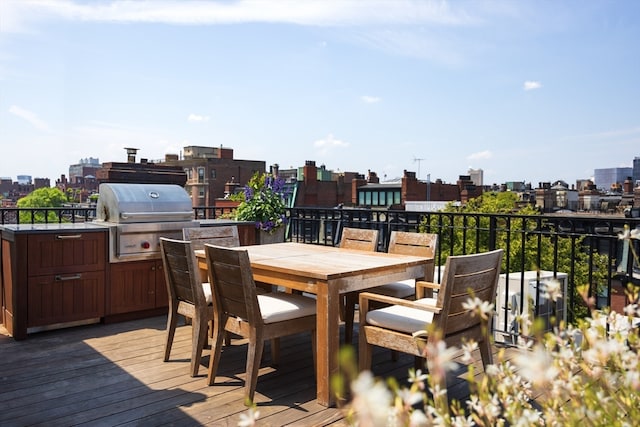 wooden terrace featuring a grill