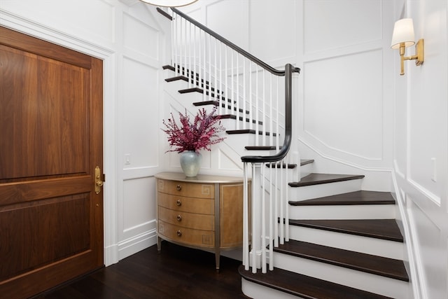 stairway featuring hardwood / wood-style floors