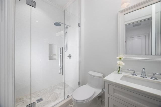 bathroom with vanity, toilet, and an enclosed shower