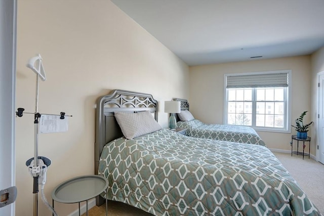 bedroom with carpet and baseboards