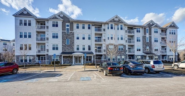 view of property featuring uncovered parking