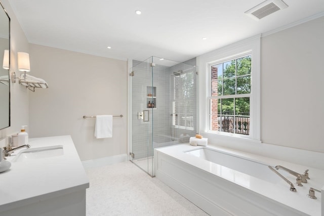 bathroom featuring separate shower and tub and vanity