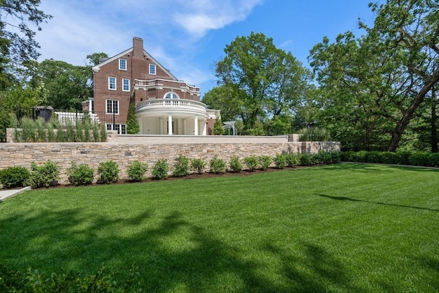 back of house with a yard