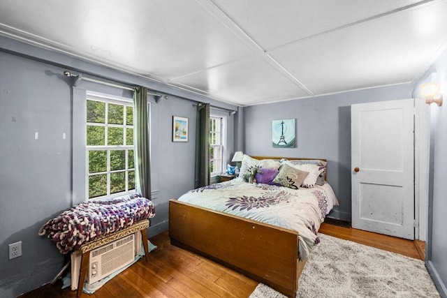 bedroom with wood finished floors