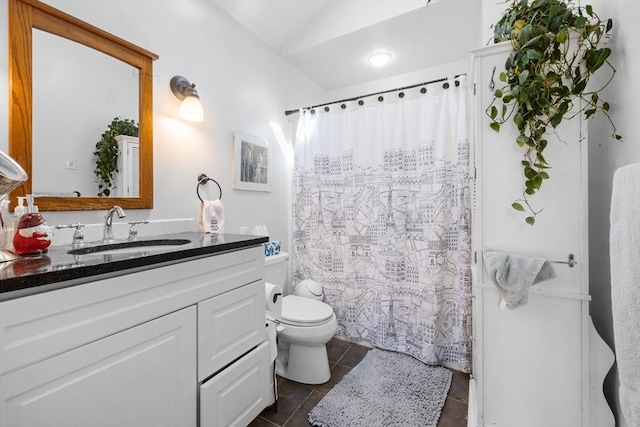 bathroom featuring lofted ceiling, toilet, tile patterned flooring, vanity, and curtained shower