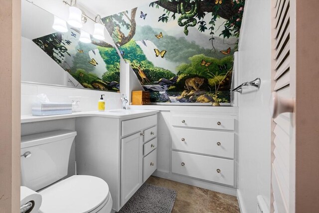 bathroom with toilet and vanity