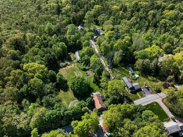 aerial view of property's location featuring a heavily wooded area