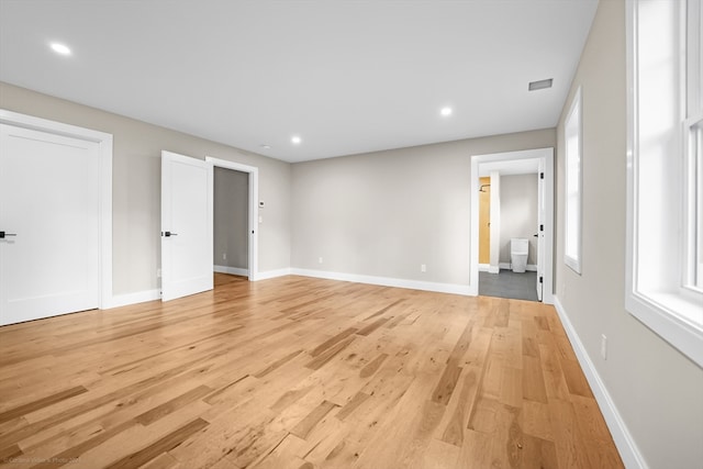 empty room with light hardwood / wood-style floors