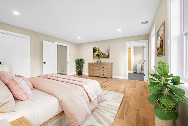 bedroom with light hardwood / wood-style flooring