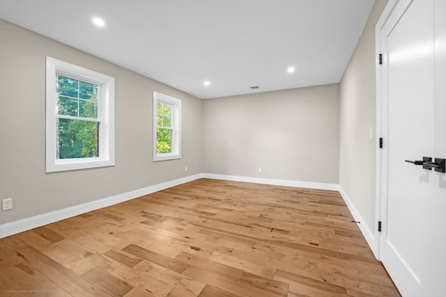 spare room with light hardwood / wood-style flooring