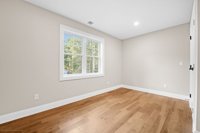 unfurnished room featuring light hardwood / wood-style flooring