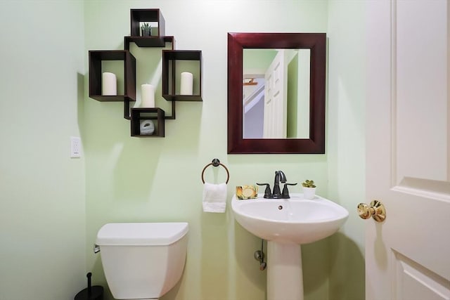 bathroom with sink and toilet