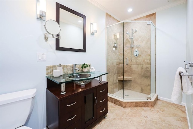 bathroom with vanity, toilet, a shower with shower door, and crown molding