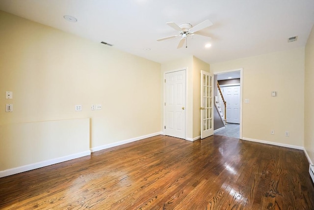 unfurnished room featuring ceiling fan, french doors, and dark hardwood / wood-style floors