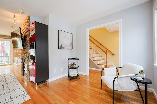 sitting room featuring hardwood / wood-style flooring