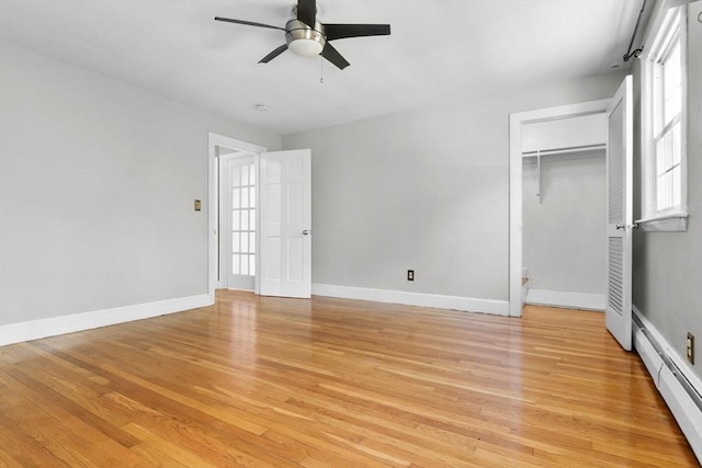 17 Topsfield Rd, Wenham, MA 01984 - unfurnished bedroom with a baseboard radiator, light wood-style flooring, baseboards, ceiling fan, and a closet