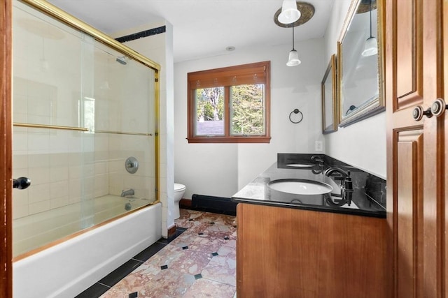 17 Topsfield Rd, Wenham, MA 01984 - full bathroom with toilet, shower / bath combination with glass door, double vanity, and tile patterned floors