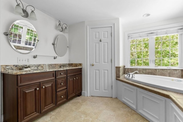 17 Topsfield Rd, Wenham, MA 01984 - full bathroom featuring double vanity, plenty of natural light, a bath, and tile patterned floors