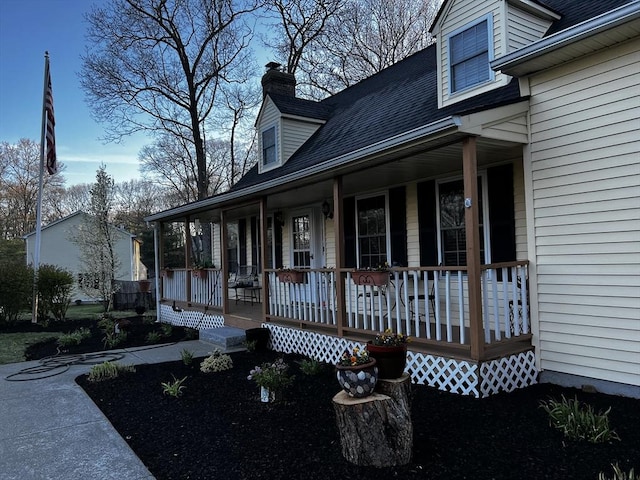 property entrance featuring covered porch