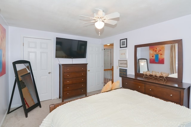 carpeted bedroom featuring ceiling fan