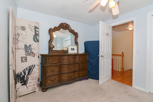 bedroom with light colored carpet and ceiling fan