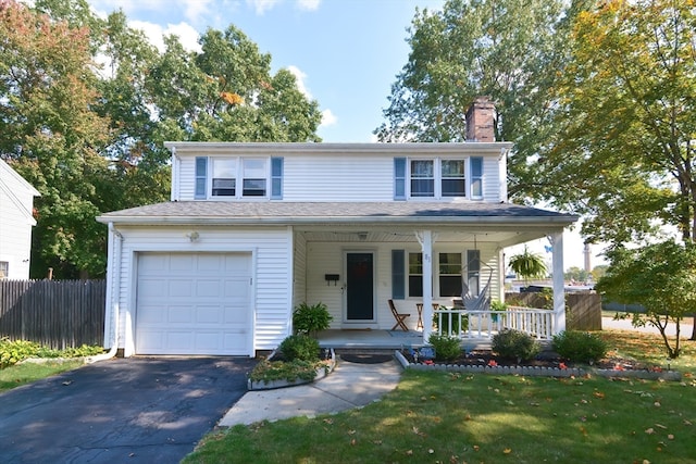 view of front facade featuring covered porch and a front yard