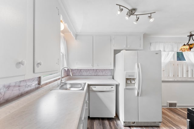 kitchen featuring white cabinetry, sink, white appliances, and dark hardwood / wood-style flooring